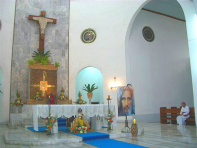 The altar of the Lipa Carmel Church with the Archbishop listening to Vassula
