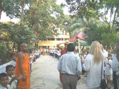 The Buddhist monks, the directors of the Orphanage and some of the 400 children were on hand to greet us with flowers and songs 